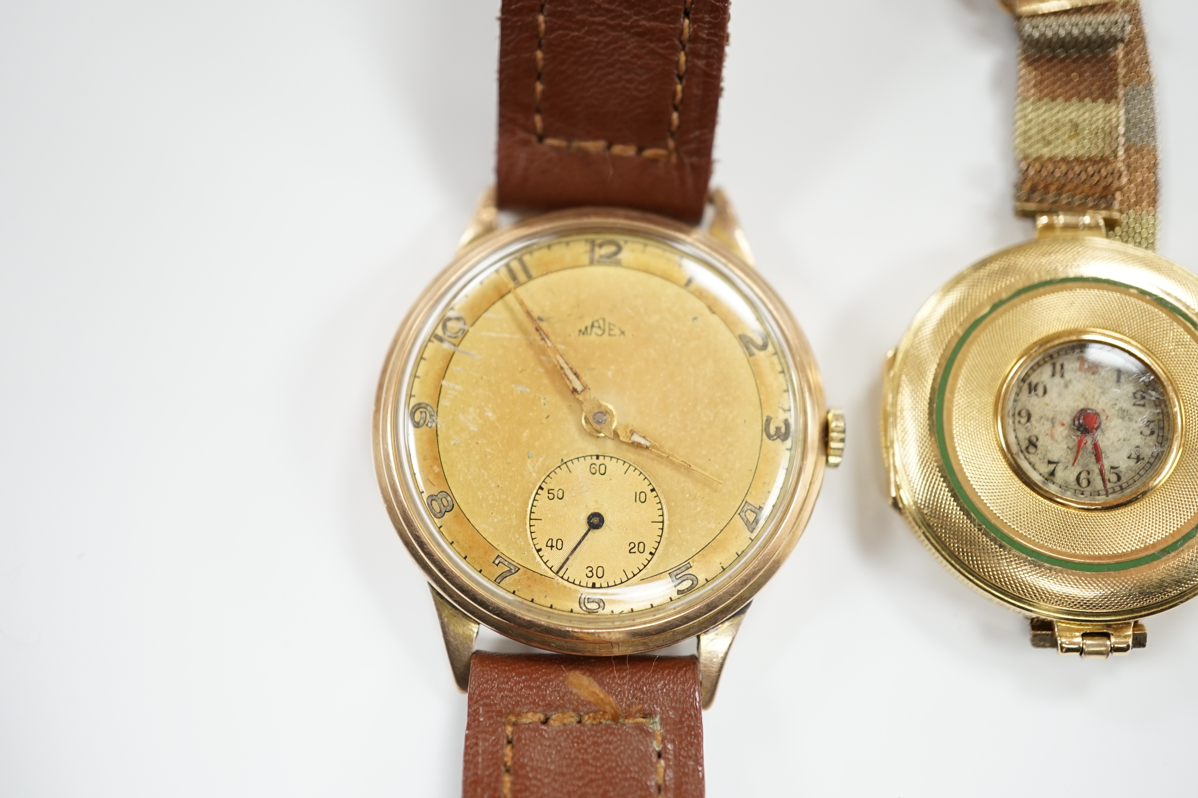 An early 20th century 18ct gold manual wind wrist watch, by Wilsdorf & Davies, on a later three colour 9ct mesh link bracelet and a gentleman's yellow metal Majex manual wind wrist watch, on a leather strap.